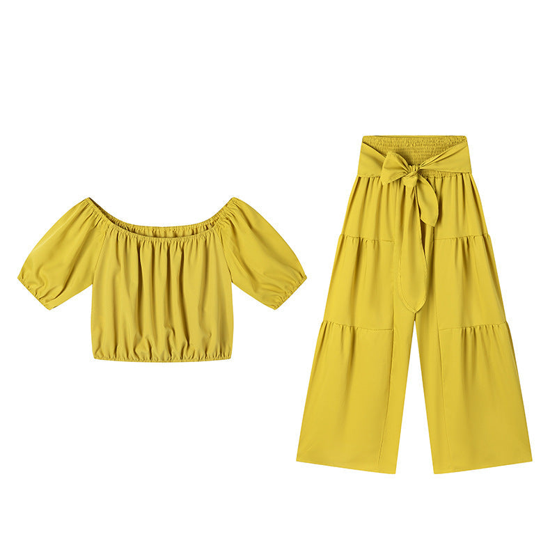 High-waisted Solid-color Flared Pants With Tie Detailing And A Flowing Drape
