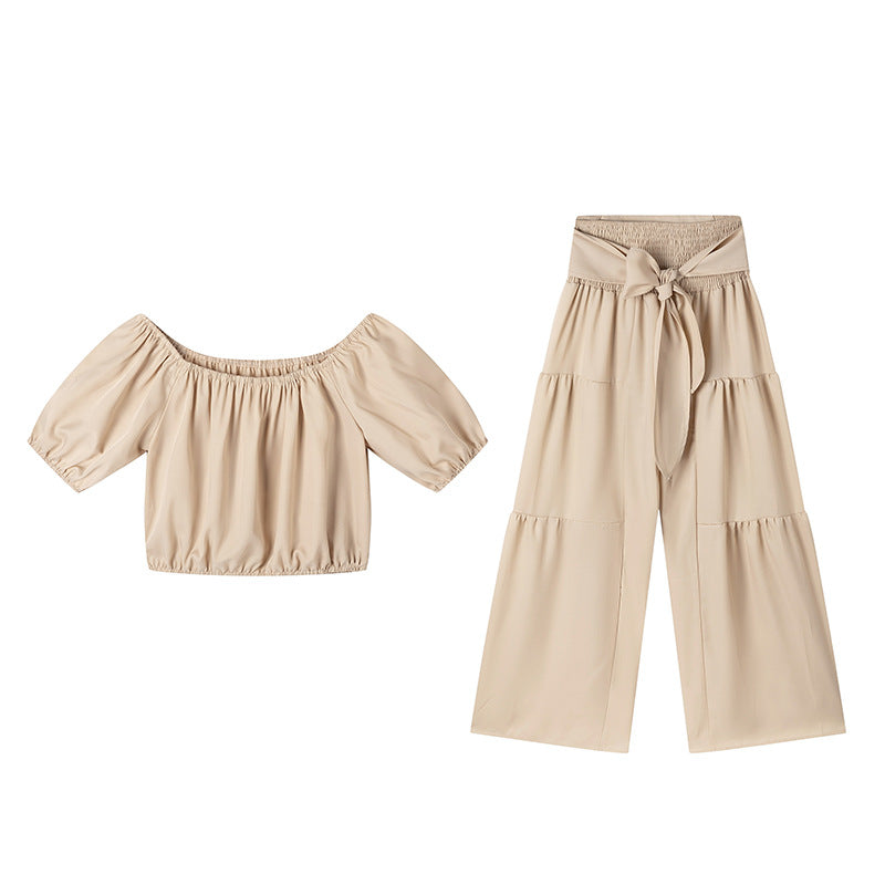 High-waisted Solid-color Flared Pants With Tie Detailing And A Flowing Drape 
