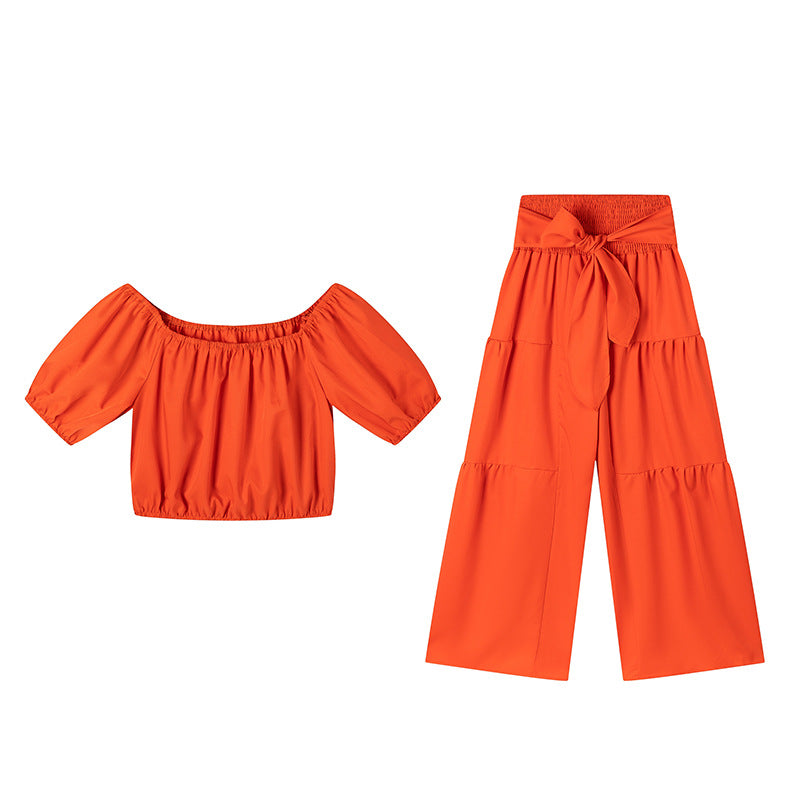 High-waisted Solid-color Flared Pants With Tie Detailing And A Flowing Drape 
