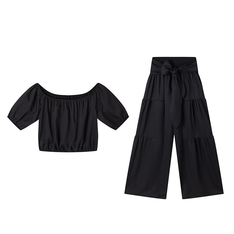 High-waisted Solid-color Flared Pants With Tie Detailing And A Flowing Drape 