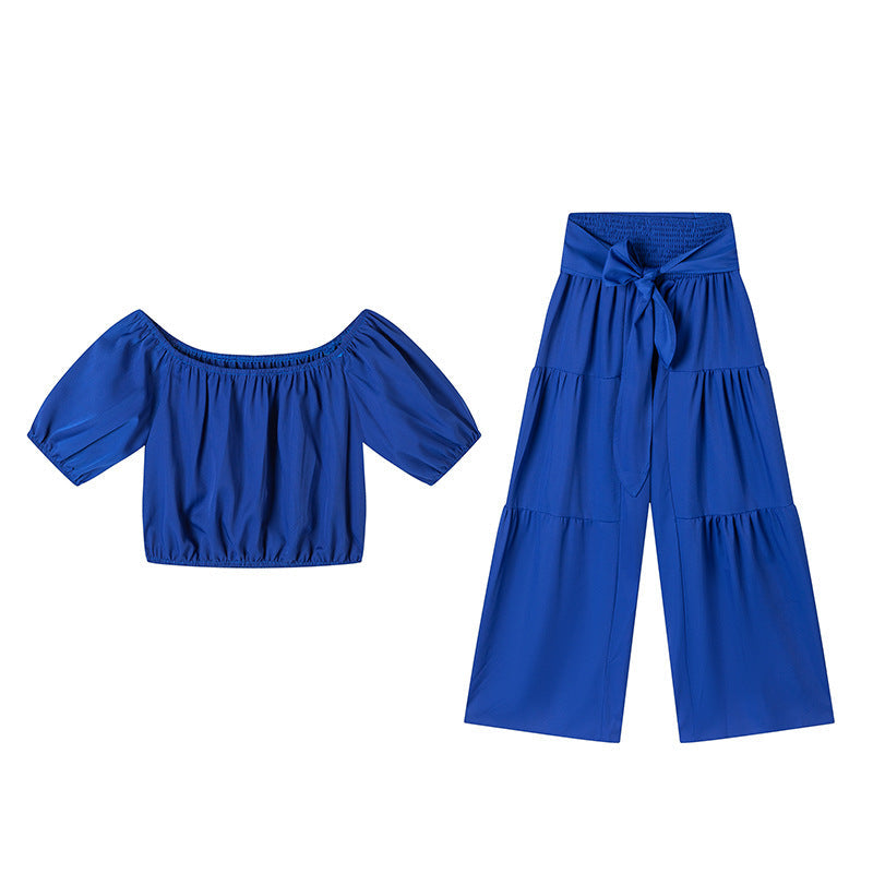 High-waisted Solid-color Flared Pants With Tie Detailing And A Flowing Drape 