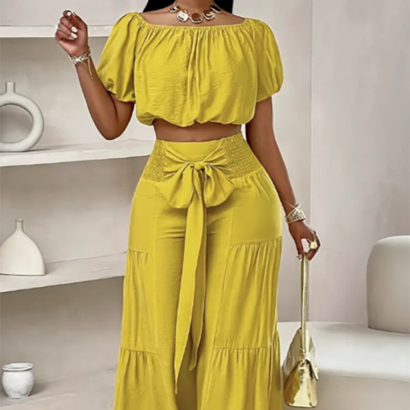 High-waisted Solid-color Flared Pants With Tie Detailing And A Flowing Drape 