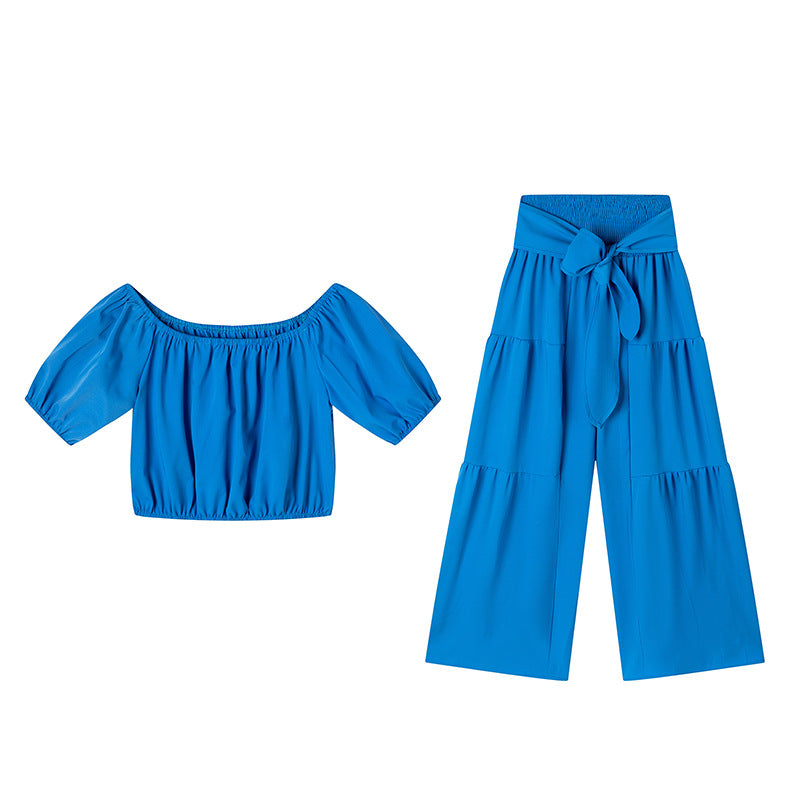 High-waisted Solid-color Flared Pants With Tie Detailing And A Flowing Drape 